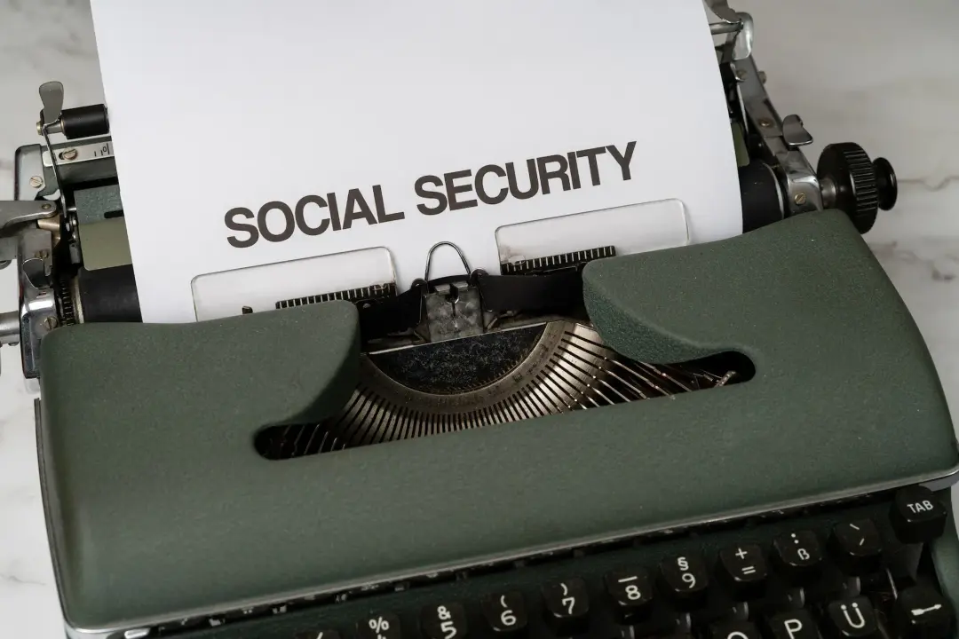 a typewriter with social security typed on a paper